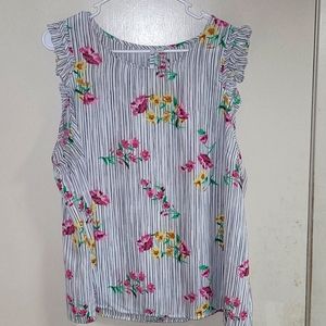 Elle sleeveless blouse with ruffle.